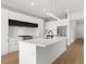Modern kitchen with white cabinets, quartz countertops and stainless steel appliances at 1810 4Th E St, Palmetto, FL 34221