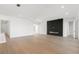 Open living area with hardwood floors and modern fireplace at 1810 4Th E St, Palmetto, FL 34221