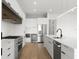 Modern kitchen with stainless steel appliances and white cabinetry at 1810 4Th E St, Palmetto, FL 34221