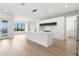 Modern kitchen with white cabinets, quartz countertops, and island at 1810 4Th E St, Palmetto, FL 34221