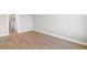 Light-filled bedroom with hardwood floors and access to bathroom at 1810 4Th E St, Palmetto, FL 34221