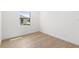 Bright bedroom with light hardwood floors and a window offering a view at 1810 4Th E St, Palmetto, FL 34221