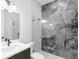 Modern bathroom with a large walk-in shower and gray tile at 1810 4Th E St, Palmetto, FL 34221