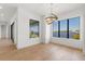 Dining room with hardwood floors and large windows overlooking the water at 1810 4Th E St, Palmetto, FL 34221