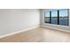Bright bedroom with light hardwood floors and water views at 1810 4Th E St, Palmetto, FL 34221