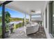 Outdoor patio with seating area overlooking a lake at 4068 Southern Valley Loop, Brooksville, FL 34601