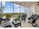 Relaxing screened porch with wicker furniture and water views at 6450 Shoreline Dr # 9105, St Petersburg, FL 33708