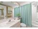 Clean bathroom with a shower/tub combo and light teal accents at 6450 Shoreline Dr # 9105, St Petersburg, FL 33708