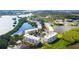 Aerial view of waterfront condo community with lush landscaping and pool at 6450 Shoreline Dr # 9105, St Petersburg, FL 33708