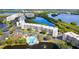 Aerial view of waterfront community featuring condos, pool, and lush landscaping at 6450 Shoreline Dr # 9105, St Petersburg, FL 33708