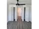 Bedroom with gray flooring and double closets at 12800 Vassar Ct, Hudson, FL 34667