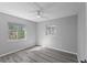 Serene bedroom with ceiling fan and wood-look floors at 4300 16Th N Ave, St Petersburg, FL 33713