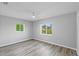 Well-lit bedroom with ceiling fan and wood-look floors at 4300 16Th N Ave, St Petersburg, FL 33713