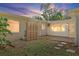 Evening view of backyard with deck and fenced-in area at 4300 16Th N Ave, St Petersburg, FL 33713