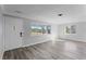 Spacious living area featuring wood-look floors and an entrance at 4300 16Th N Ave, St Petersburg, FL 33713