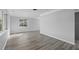 Bright living room with wood-look floors and large windows at 4300 16Th N Ave, St Petersburg, FL 33713