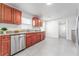 Modern kitchen with granite counters, wood cabinets, and stainless steel appliances at 701 17Th S Ave, St Petersburg, FL 33701