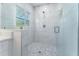 Modern bathroom with a large walk-in shower, marble tile, and a spacious layout at 701 17Th S Ave, St Petersburg, FL 33701