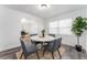 Bright dining area with white table, gray chairs, and hardwood floors at 701 17Th S Ave, St Petersburg, FL 33701