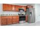 Modern kitchen with stainless steel appliances and wood cabinets at 701 17Th S Ave, St Petersburg, FL 33701