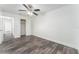 Spacious bedroom with wood-look flooring, ceiling fan, and ample closet space at 701 17Th S Ave, St Petersburg, FL 33701