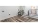 Unfinished basement area with a water heater and stairs leading upstairs at 701 17Th S Ave, St Petersburg, FL 33701