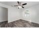Bright bedroom with ceiling fan, window blinds, and laminate wood floor at 701 17Th S Ave, St Petersburg, FL 33701