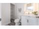 Small bathroom with white vanity, toilet, and linen closet at 701 17Th S Ave, St Petersburg, FL 33701
