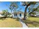 Front view of charming house with blue door and walkway at 701 17Th S Ave, St Petersburg, FL 33701