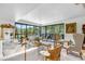 Bright and airy living room with ample natural light and comfortable seating at 8 Belleview Blvd # 203, Belleair, FL 33756