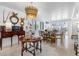 Bright dining room features a stunning chandelier and stylish table setting at 8 Belleview Blvd # 203, Belleair, FL 33756