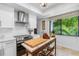 Modern kitchen with stainless steel appliances and butcher block countertops at 8 Belleview Blvd # 203, Belleair, FL 33756