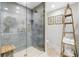 Modern shower with glass enclosure and gray tile walls at 8 Belleview Blvd # 203, Belleair, FL 33756