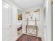 Elegant hallway with contemporary art and a marble console table at 8 Belleview Blvd # 203, Belleair, FL 33756