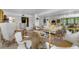 Spacious living room with large windows and comfortable seating area at 8 Belleview Blvd # 203, Belleair, FL 33756