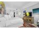 Bright bedroom with a comfortable bed and a view of the balcony at 8 Belleview Blvd # 203, Belleair, FL 33756