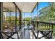 Enjoy the view from this screened balcony, complete with outdoor furniture at 8 Belleview Blvd # 203, Belleair, FL 33756
