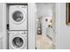 Stacked LG washer and dryer in a convenient laundry closet at 8 Belleview Blvd # 203, Belleair, FL 33756