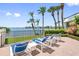 Relaxing patio with waterfront views and lounge chairs at 8 Belleview Blvd # 203, Belleair, FL 33756