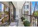 Private balcony features metal furniture and lush greenery at 8 Belleview Blvd # 203, Belleair, FL 33756