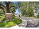Landscaped entrance to Belleview Blvd with brick signage at 8 Belleview Blvd # 203, Belleair, FL 33756
