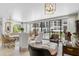 Bright living room with water views and comfortable seating at 8 Belleview Blvd # 203, Belleair, FL 33756