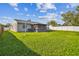 Large backyard with screened porch and fenced area at 5713 Ridgestone Dr, Tampa, FL 33625