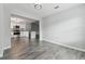 Bright dining room with gray vinyl flooring and an open concept view of the kitchen at 5713 Ridgestone Dr, Tampa, FL 33625