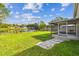 Large backyard with screened porch and pond view at 5713 Ridgestone Dr, Tampa, FL 33625