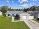 Cute single-story home with attached garage and landscaped yard at 5713 Ridgestone Dr, Tampa, FL 33625