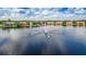 Community lake with fountain and townhome reflections at 9650 Lake Chase Island Way # 9650, Tampa, FL 33626