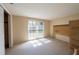 Bright bedroom featuring neutral carpet, natural light from the windows, and a large closet at 12210 Buttonwood Row, Hudson, FL 34667