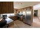 Functional kitchen featuring stainless steel appliances and tile floors at 12210 Buttonwood Row, Hudson, FL 34667