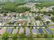 Overhead view of the property, showcasing its placement within the community and surrounding trees and neighborhood at 30735 Lanesborough Cir, Wesley Chapel, FL 33543